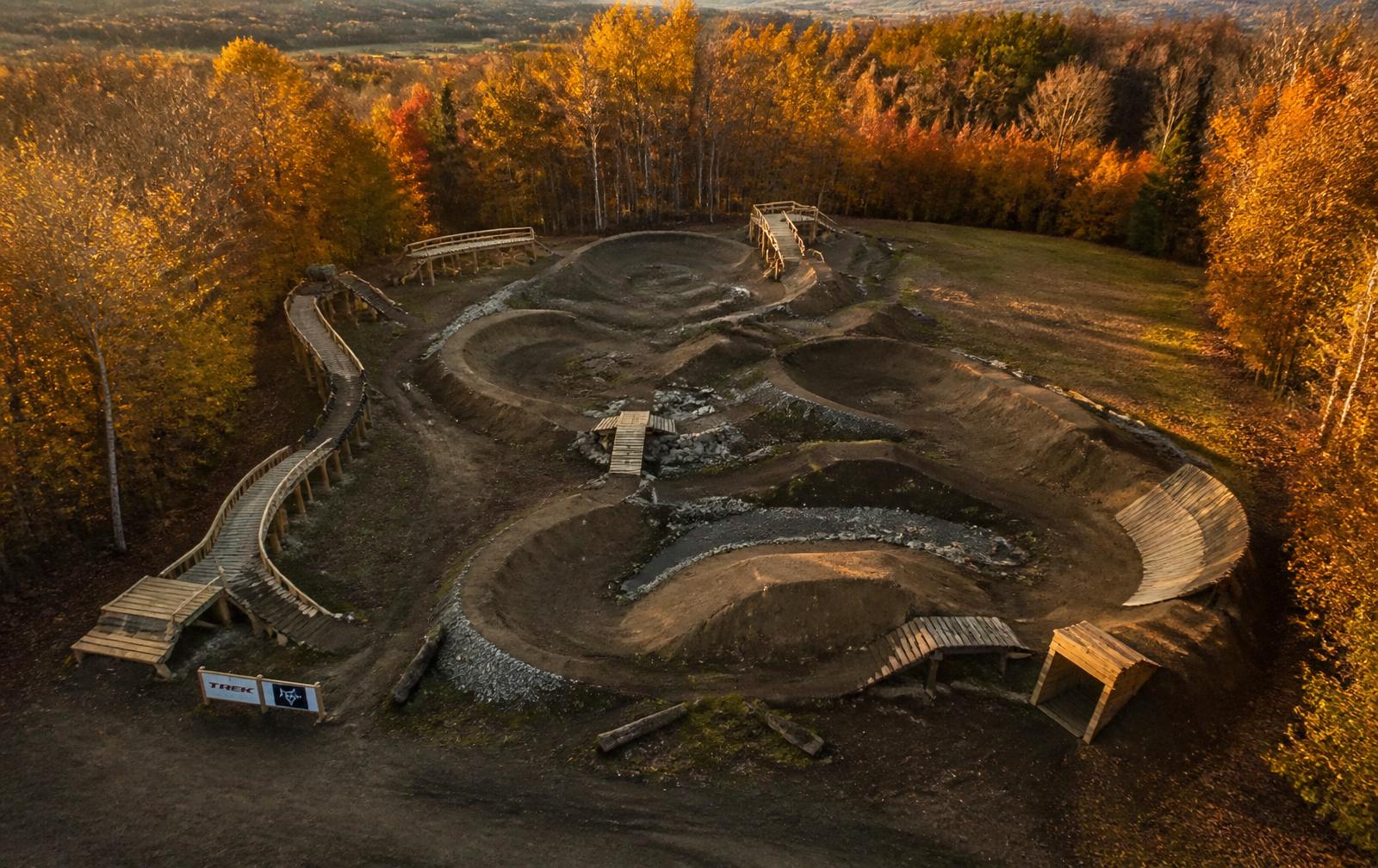 Winding mountain bike trails among autumn trees